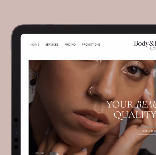 Close-up of a woman with a nose ring touching her face, displayed on a tablet screen showing a beauty website.