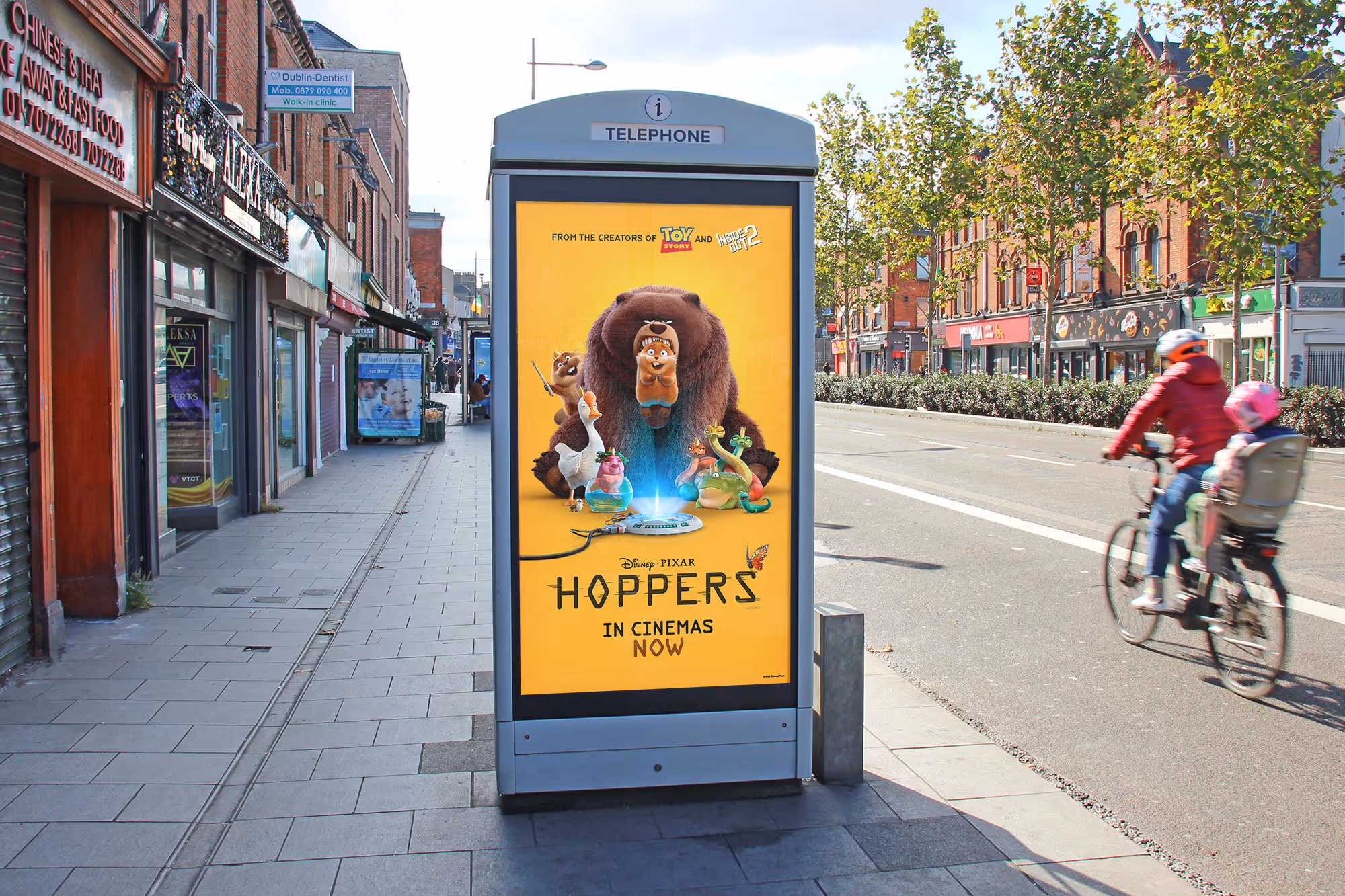 An Adshel Live Kiosk on a city centre street displaying an advertisement for Disney Pixar