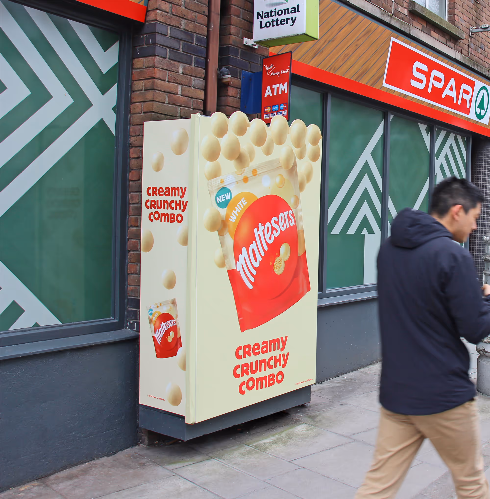 A fully encased Adbox Extra campaign for Maltesers, with a die-cut front panel with 'floating' Maltesers