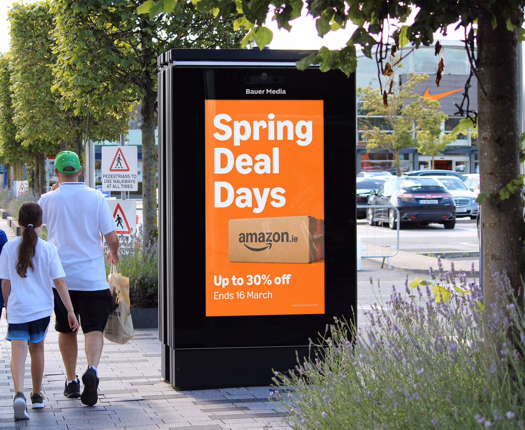 An outdoor Adshel Live Retail screen in a retail park