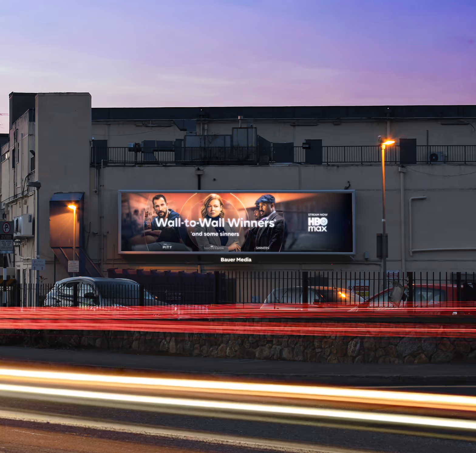 an illuminated 96 Sheet Lightbox displaying an advert for HBO Max, at dusk