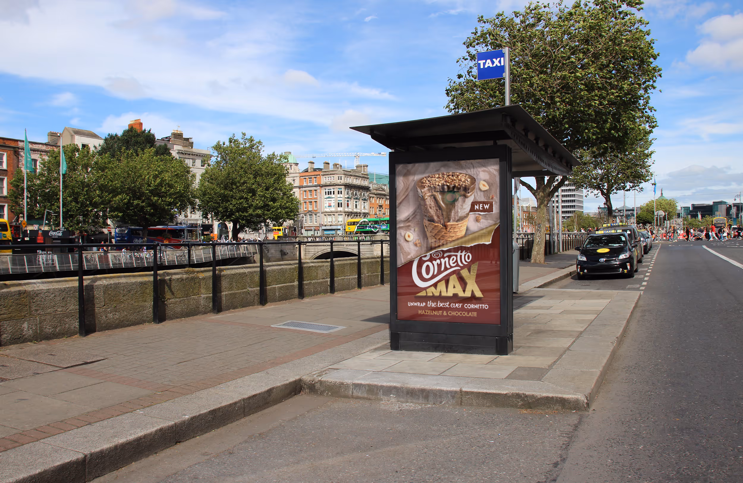 A classic bus shelter advertisement on a busy road 
