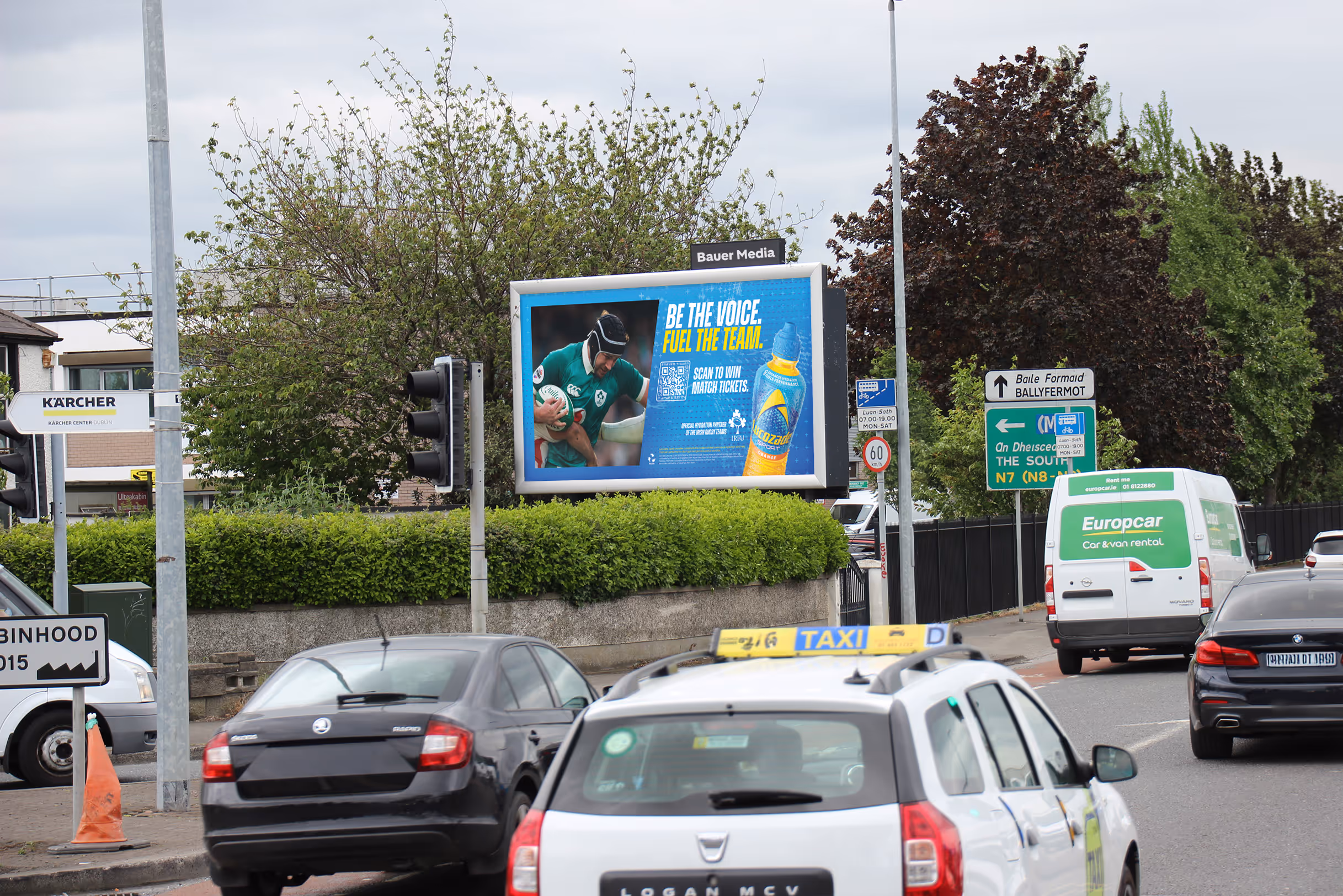 A billboard lightbox displaying an ad for Lucozade Sport