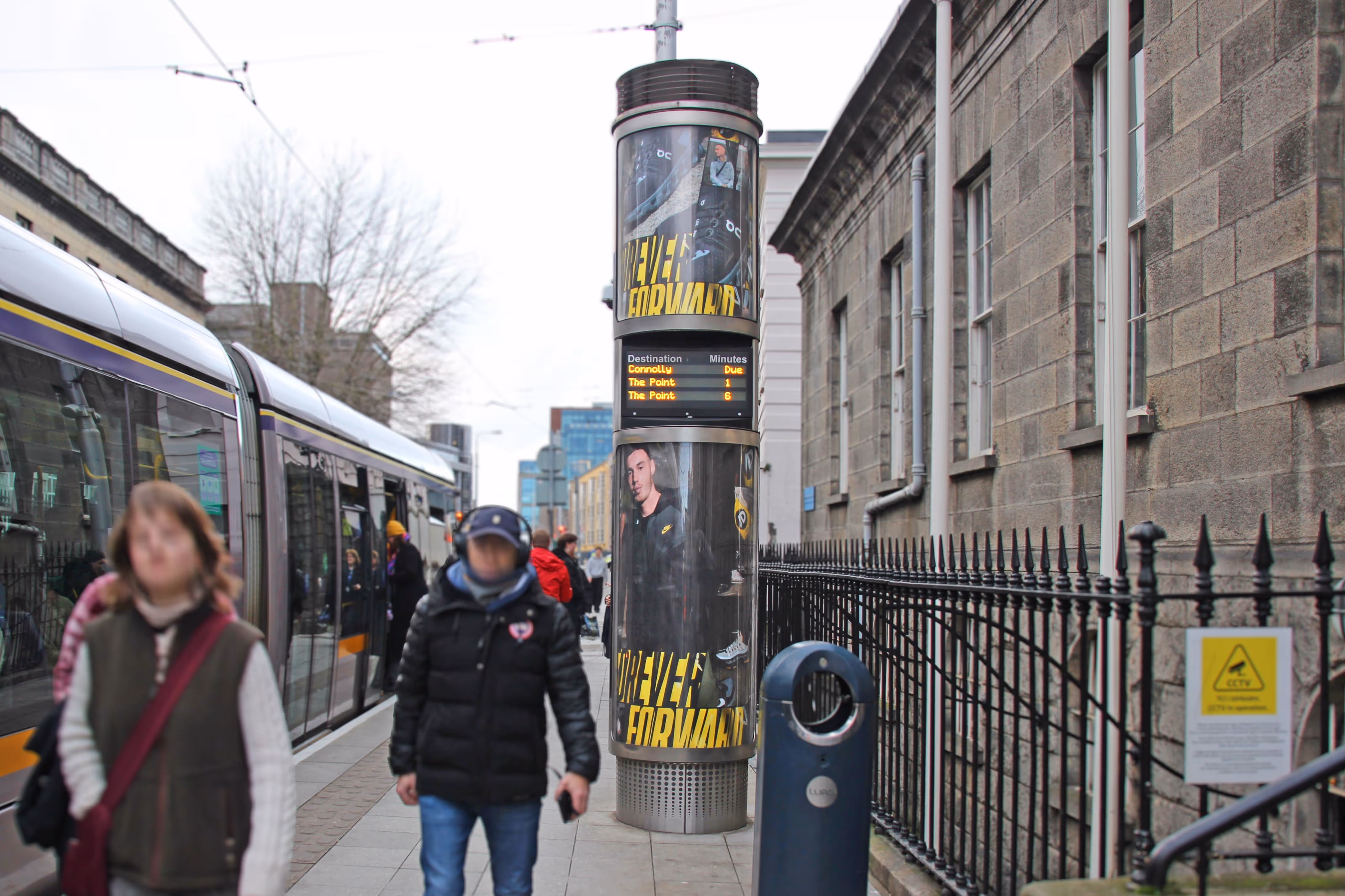 A Luas Column displaying an ad for JD Sports