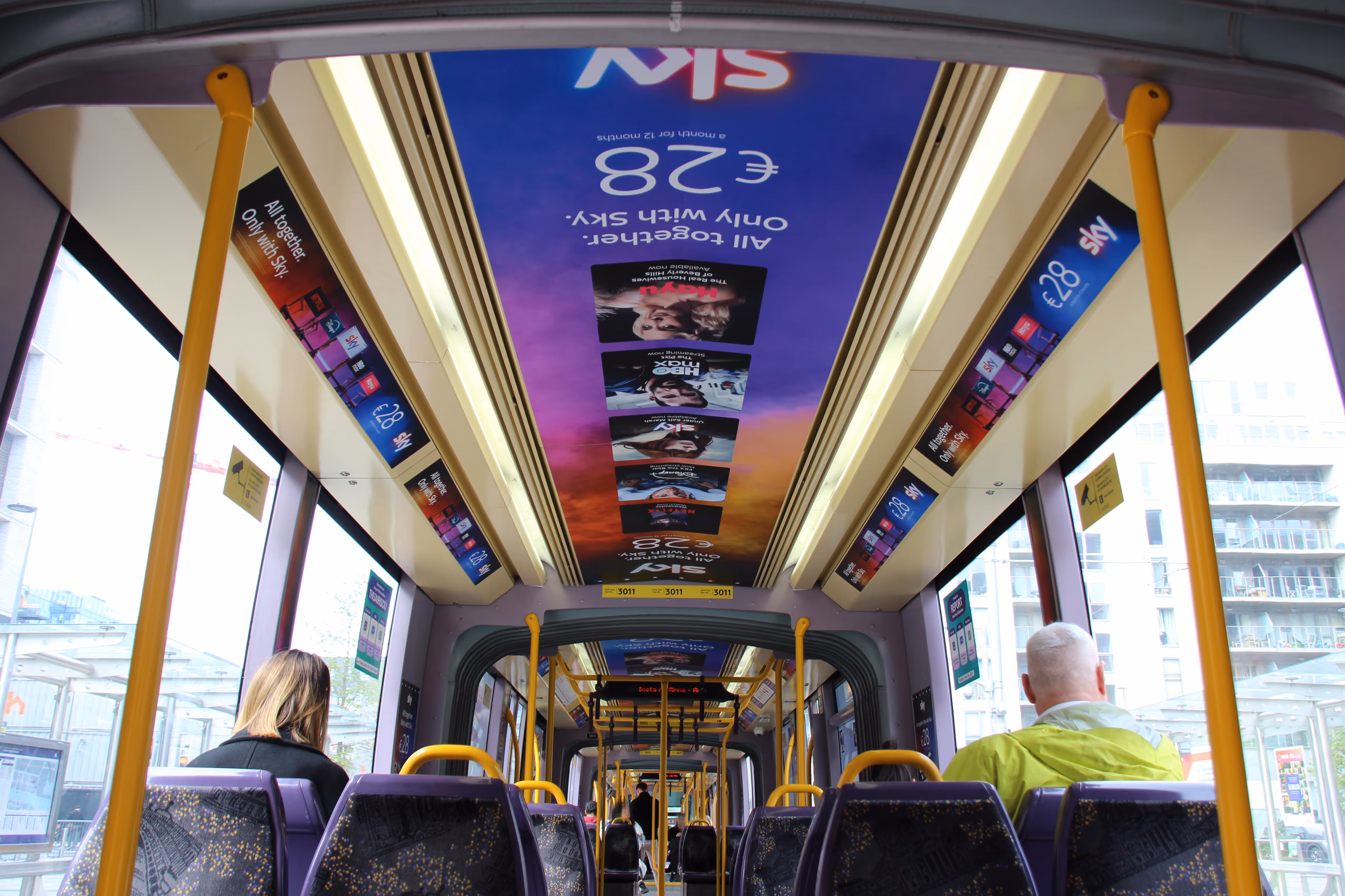 The Interior of a luas tram with an internal domination campaign for Sky TV