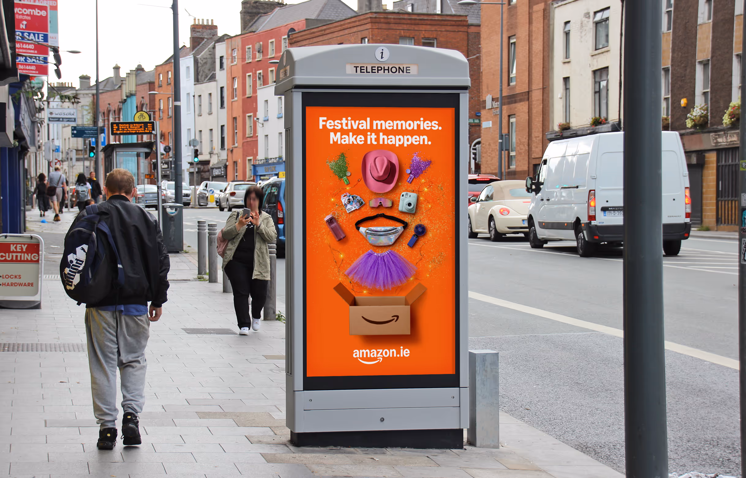 An Adshel Live Kiosk loacted on a busy road displaying an advertisement for Amazon.ie
