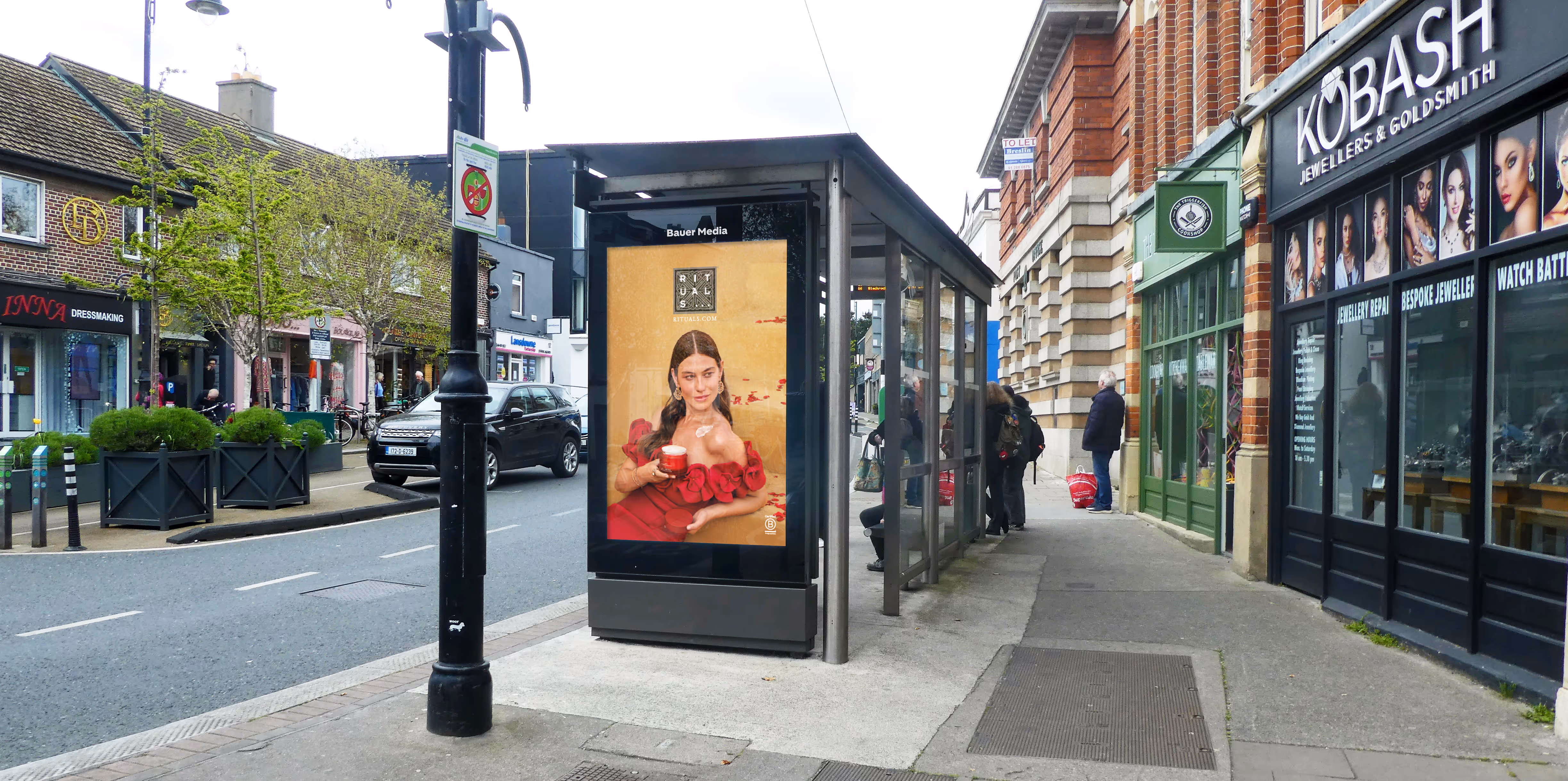 Digital bus shelter advertisment on a busy Dublin street