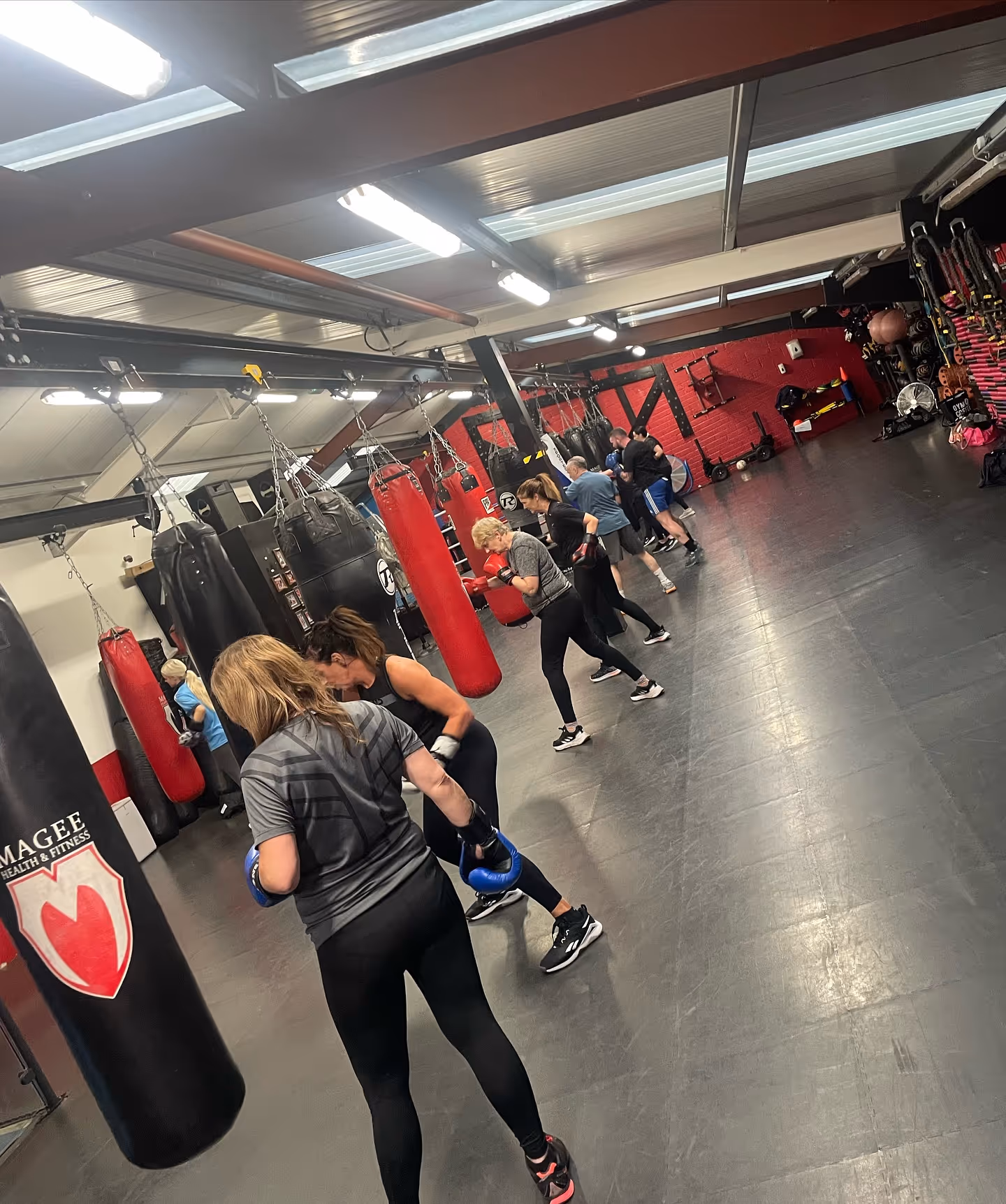 Group boxing fitness class on bags at Magee Health & Fitness Belfast