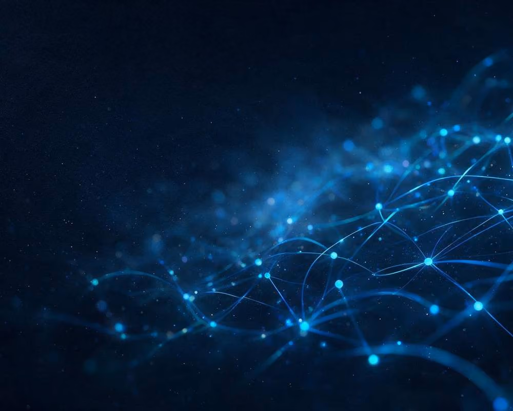 A field of connected blue nodes spreading across a dark background