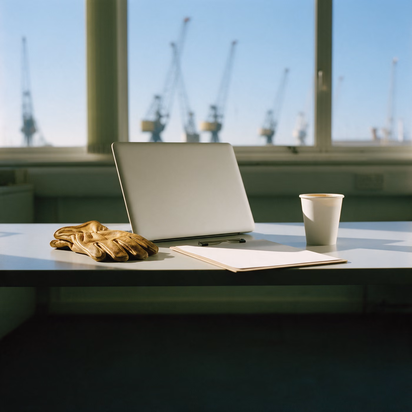 IT support Southampton: a freight forwarder's desk with dockside cranes beyond the window