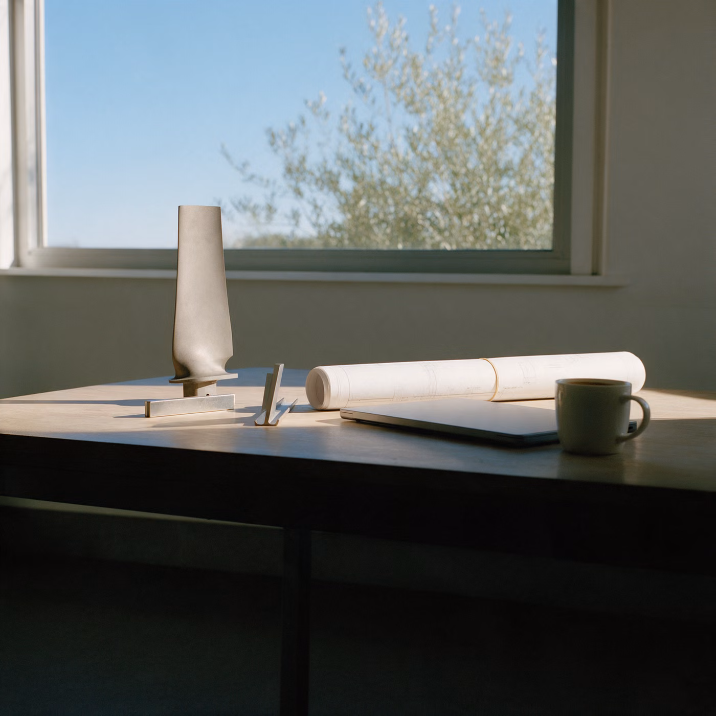 IT support Farnborough: an aerospace engineer's desk with a turbine blade and drawings