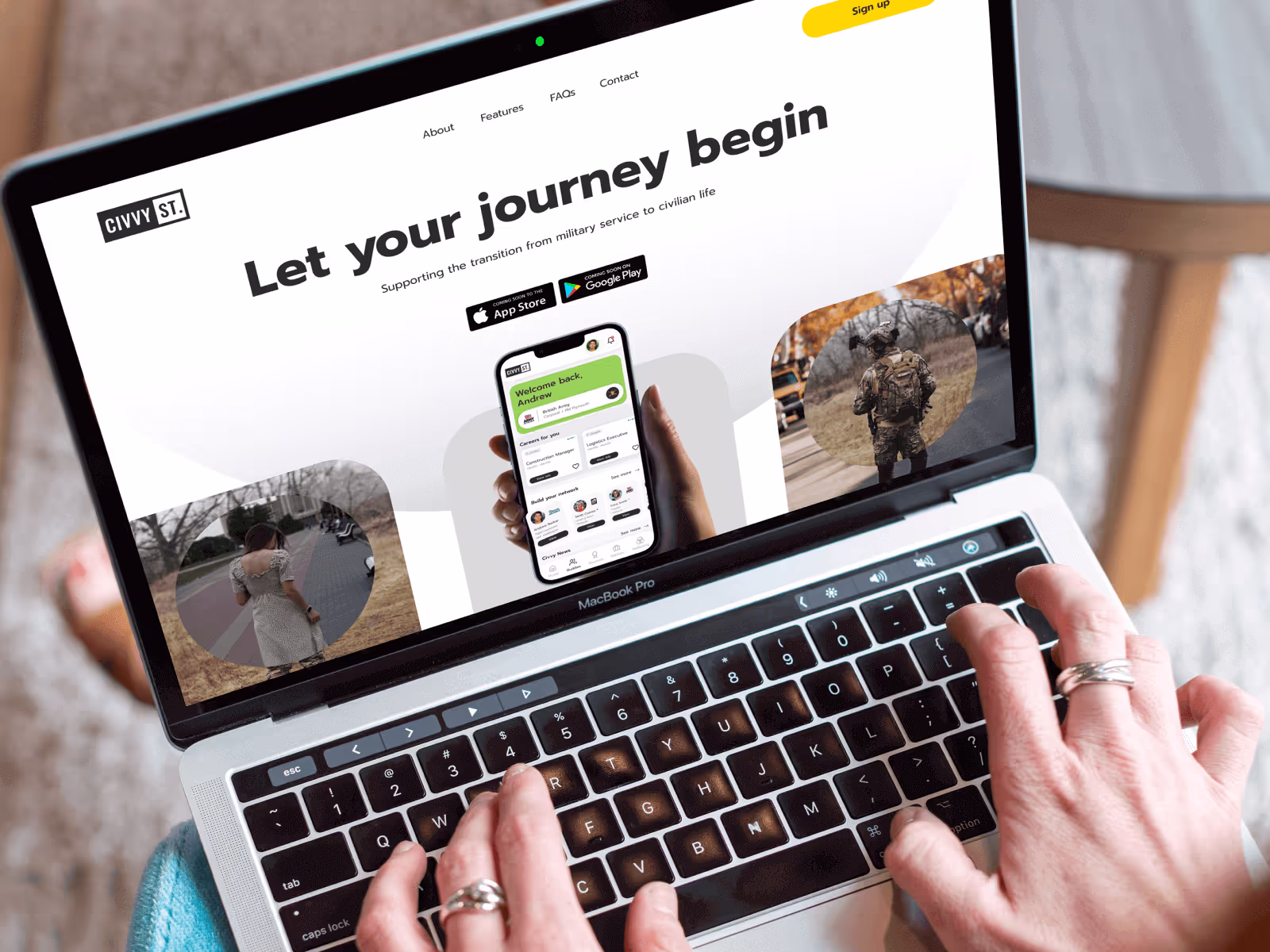 Photograph of a laptop on someone's lap seeing Civvy Street's landing page