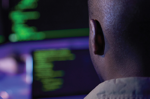 Concrete dock extending into calm water with marine equipment and a fueling station on the right.