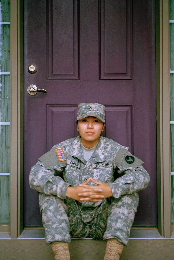 Veteran in a wheelchair spending time outdoors with his children