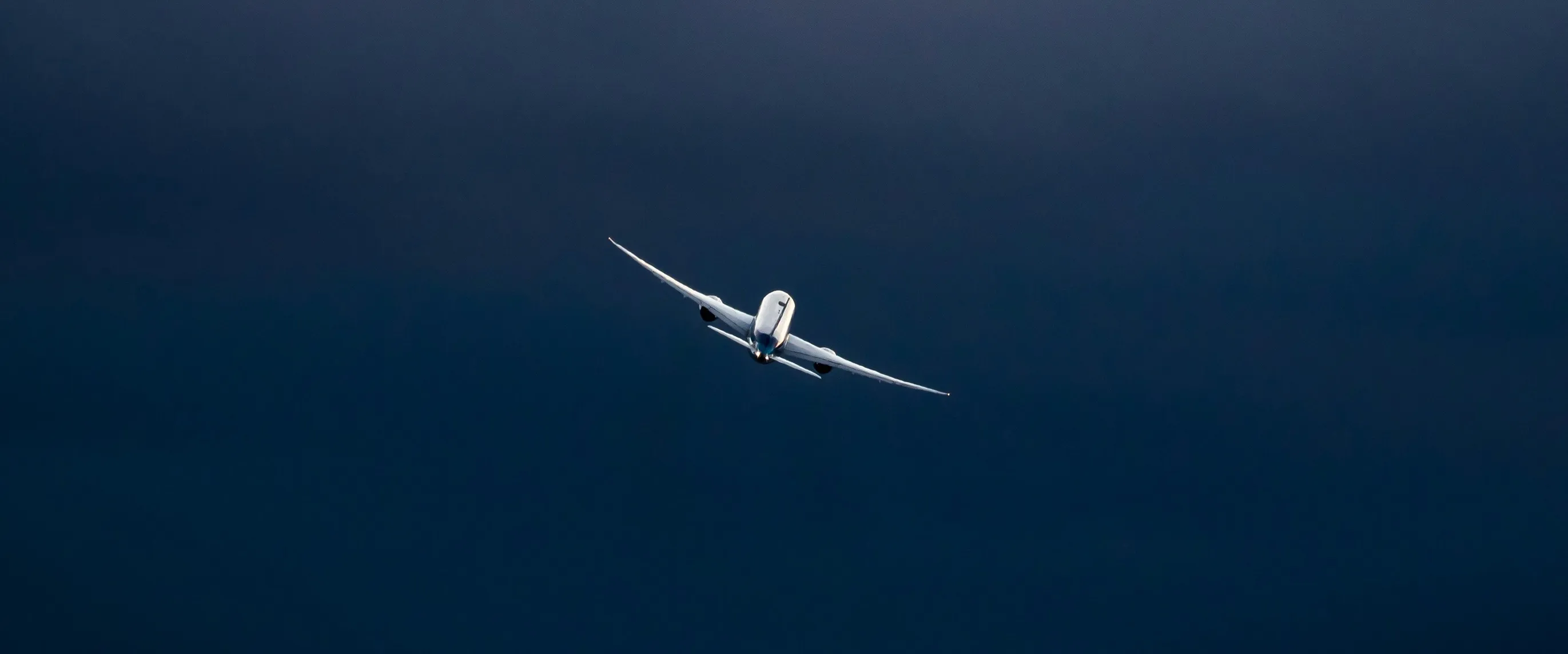 Commercial jet banking through a stormy sky — aviation and aerospace services