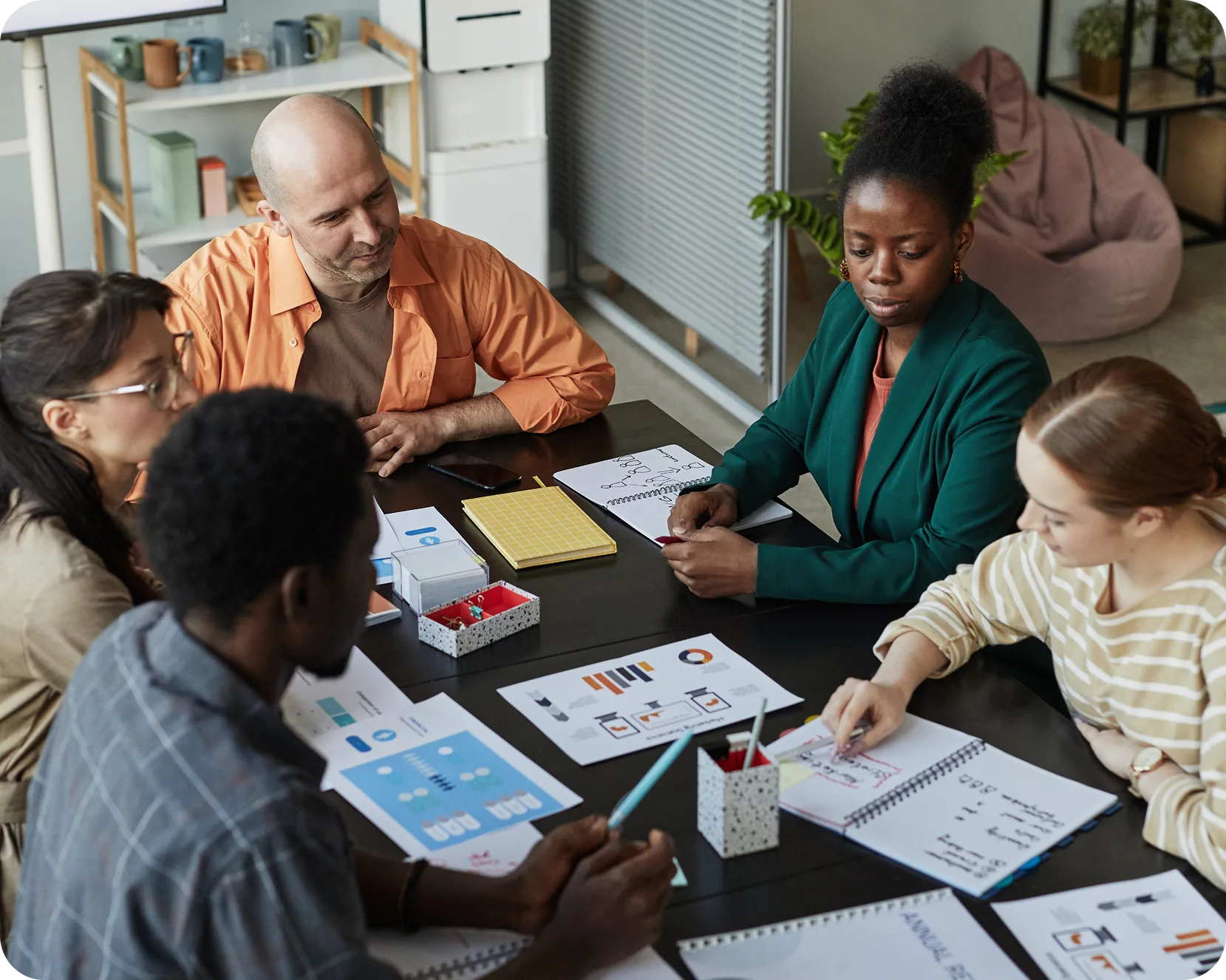 a group of people sitting around a table
