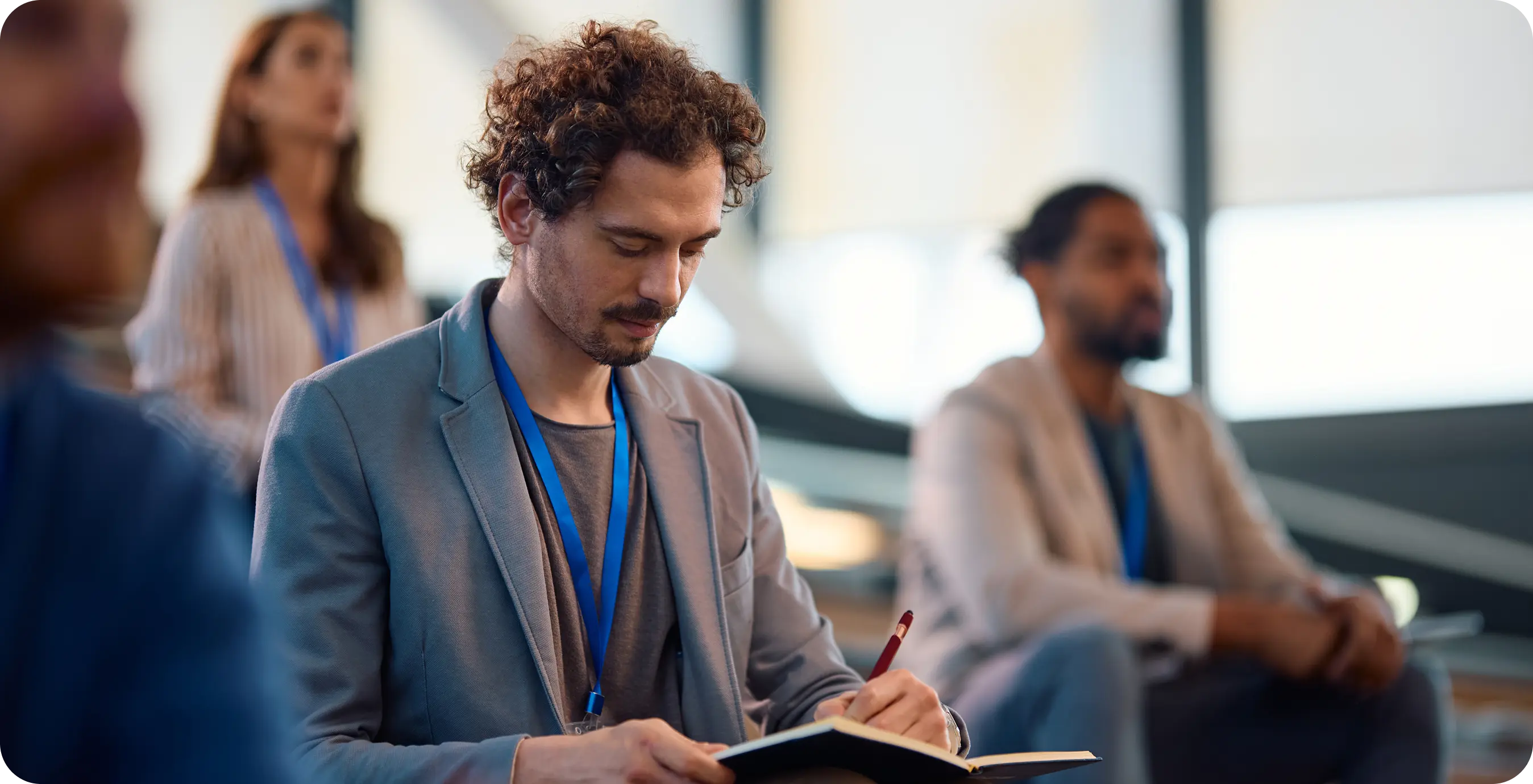 a man writing in a book