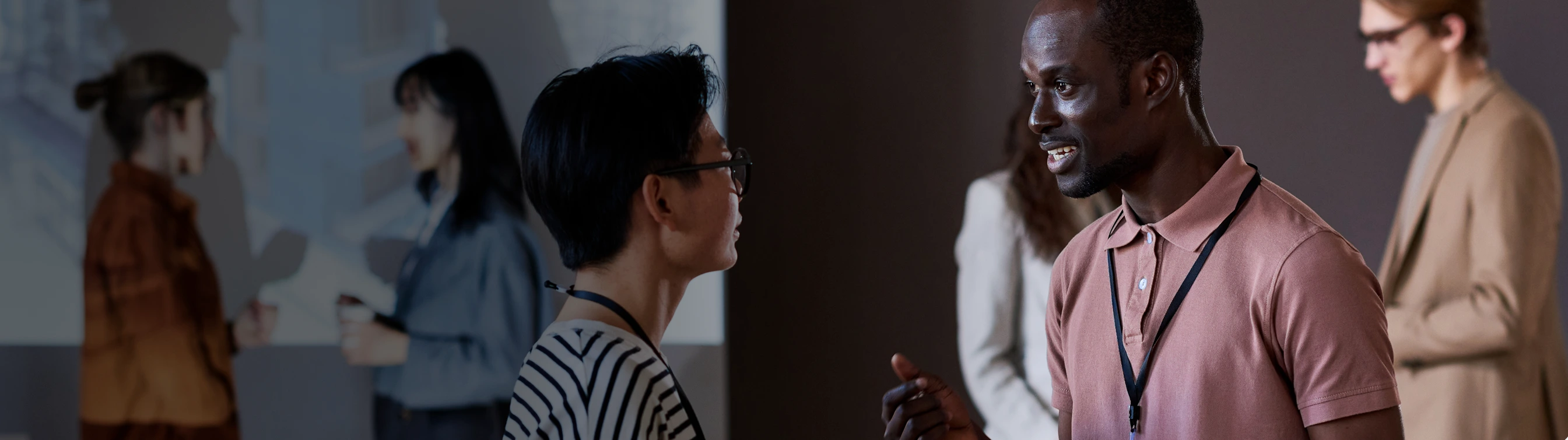 A couple of people standing next to each other.