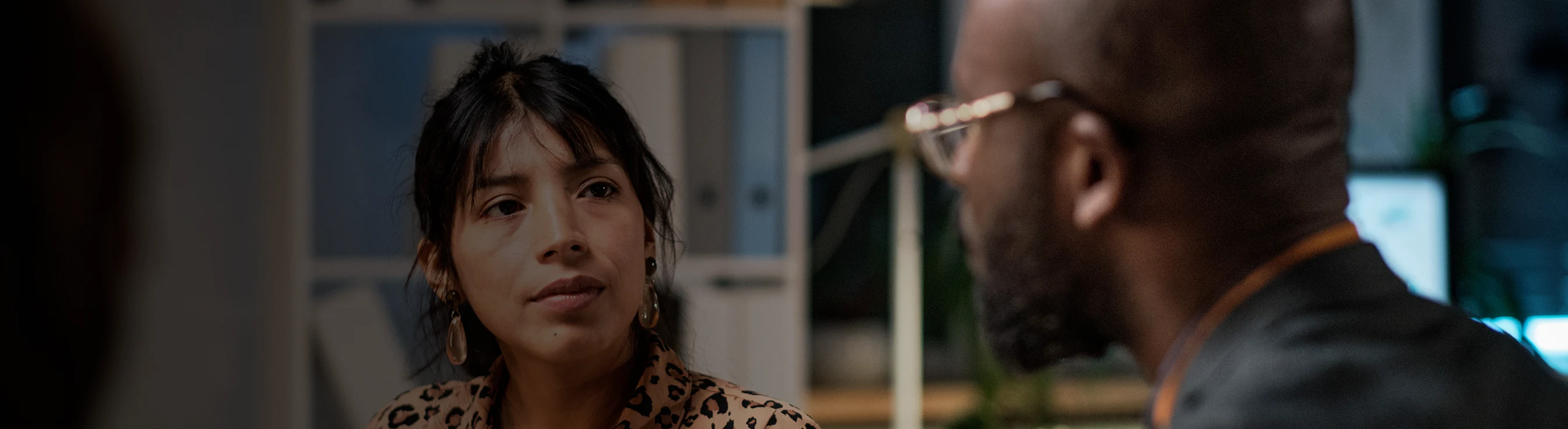 A man and a woman looking at each other.