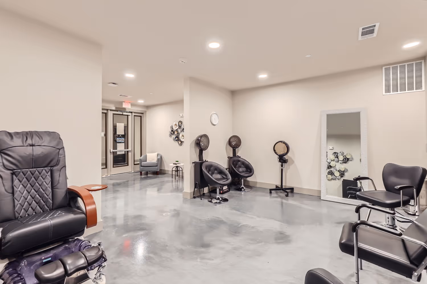 Hair salon with wash bowls and pedicure chairs