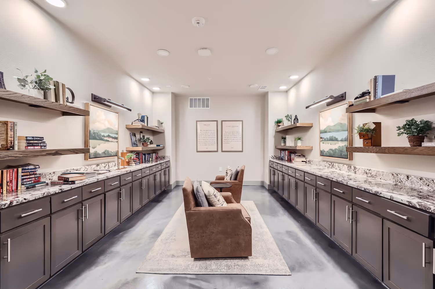 Library room with lounge chairs and books on counters