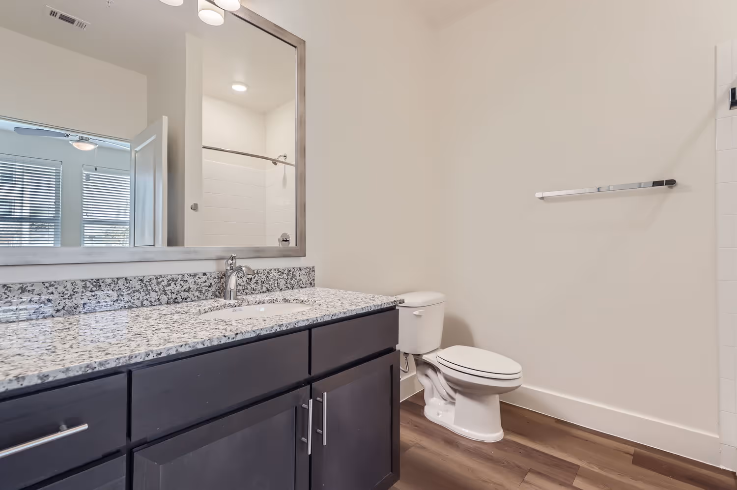 Bathroom vanity with a single sink and toilet