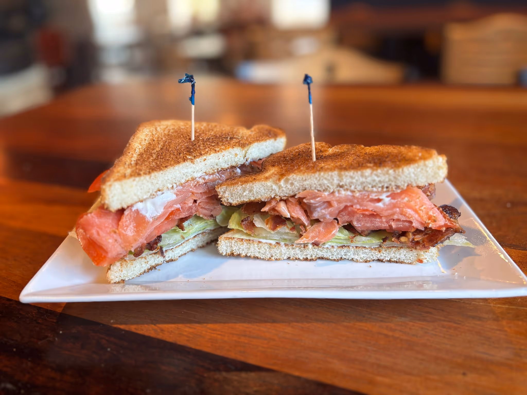 A sandwich with two toothpicks in it.