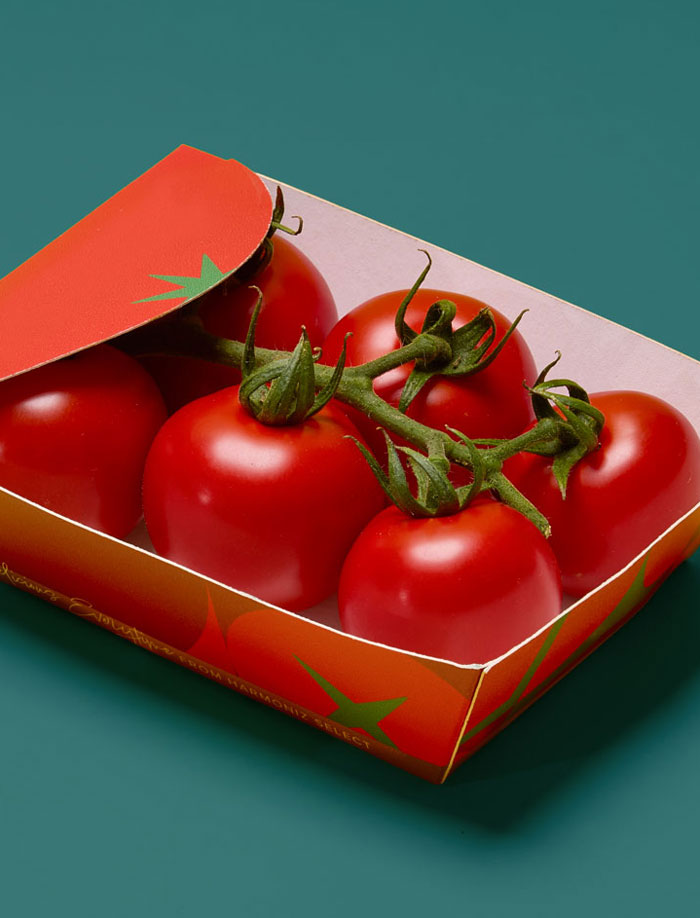 Close-up of multiple fresh green cucumbers arranged overlapping on a brown surface.