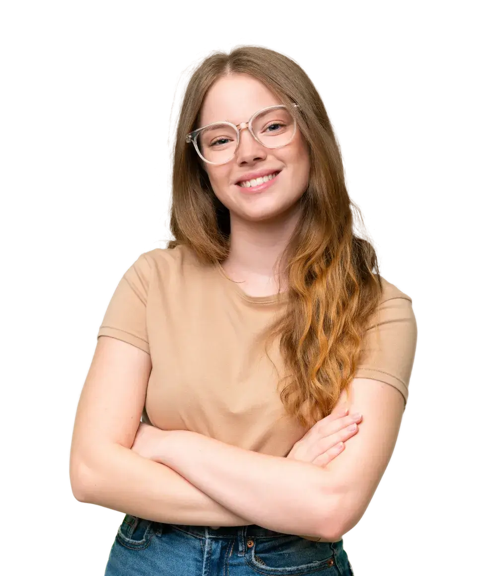 Young woman with glasses, wearing a beige shirt, smiling with arms crossed.