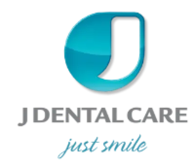 Dental Care Just Smile logo with stylized blue tooth icon above the text.