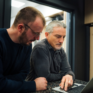 Team discussing trade retail strategy around plans.