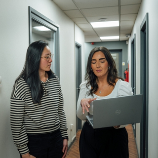 Team discussing point of purchase strategy around design plans.