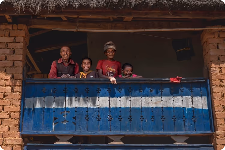 A family on a balcony.