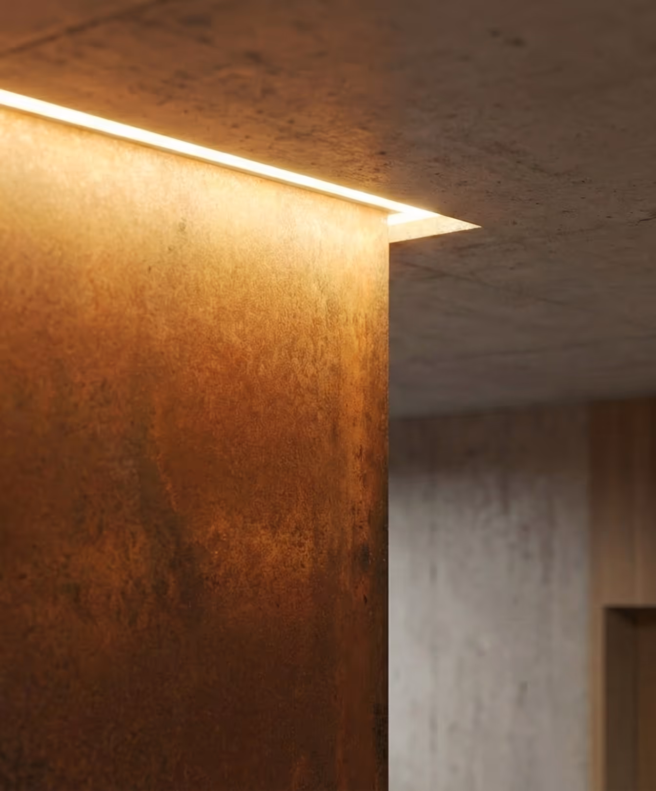 Detailní záběr na rohovou část zrezivělého kovového sloupu a část betonového stropu s vestavěným osvětlením.