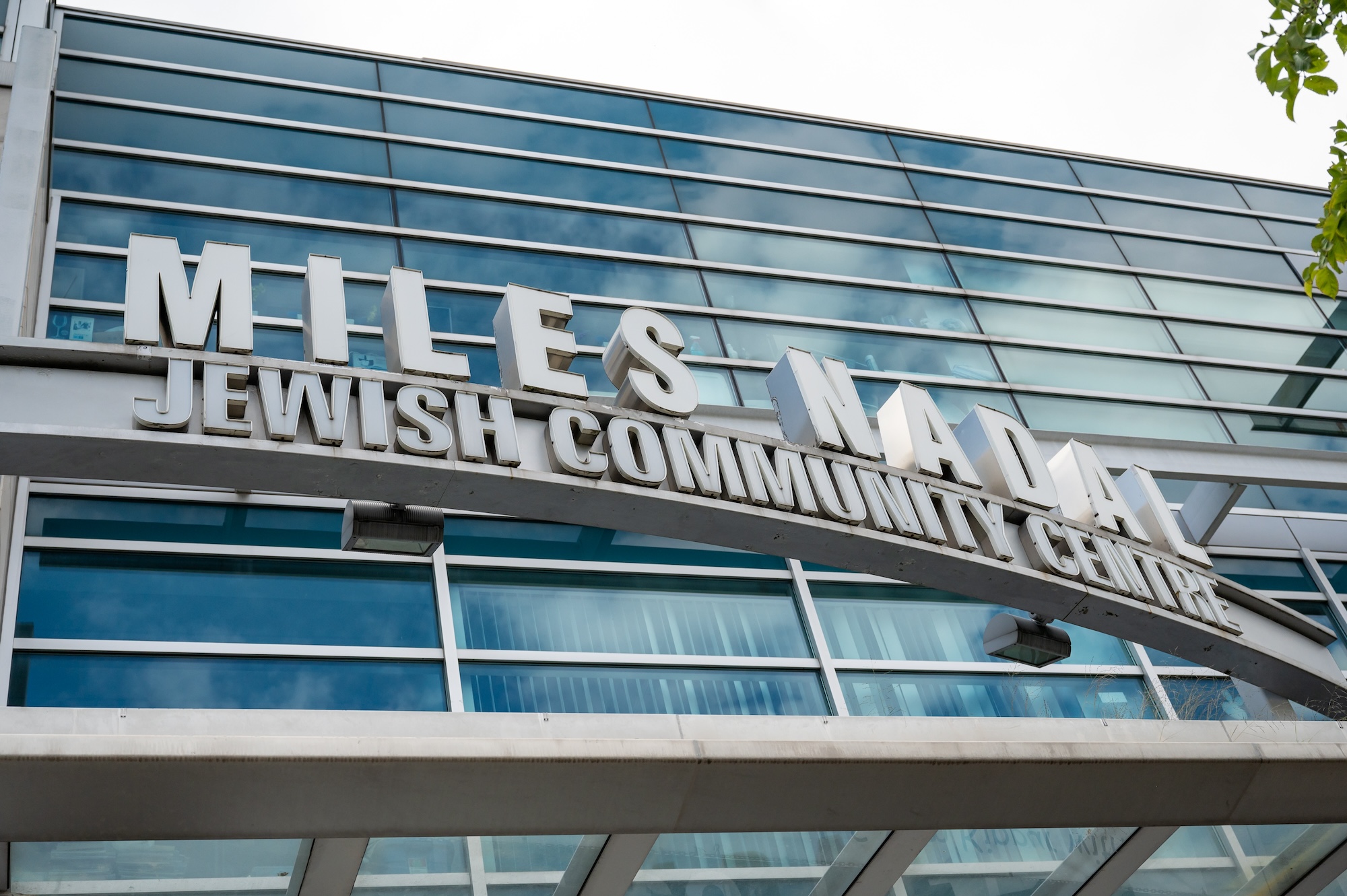 Exterior view of the Miles Nadal Jewish Community Centre building with its name displayed in large white letters above the entrance.