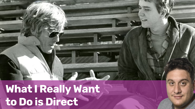 Black and white photo of two men talking while sitting in stadium bleachers with text overlay 'What I Really Want to Do is Direct' and a color photo of a man's headshot in the bottom right corner.