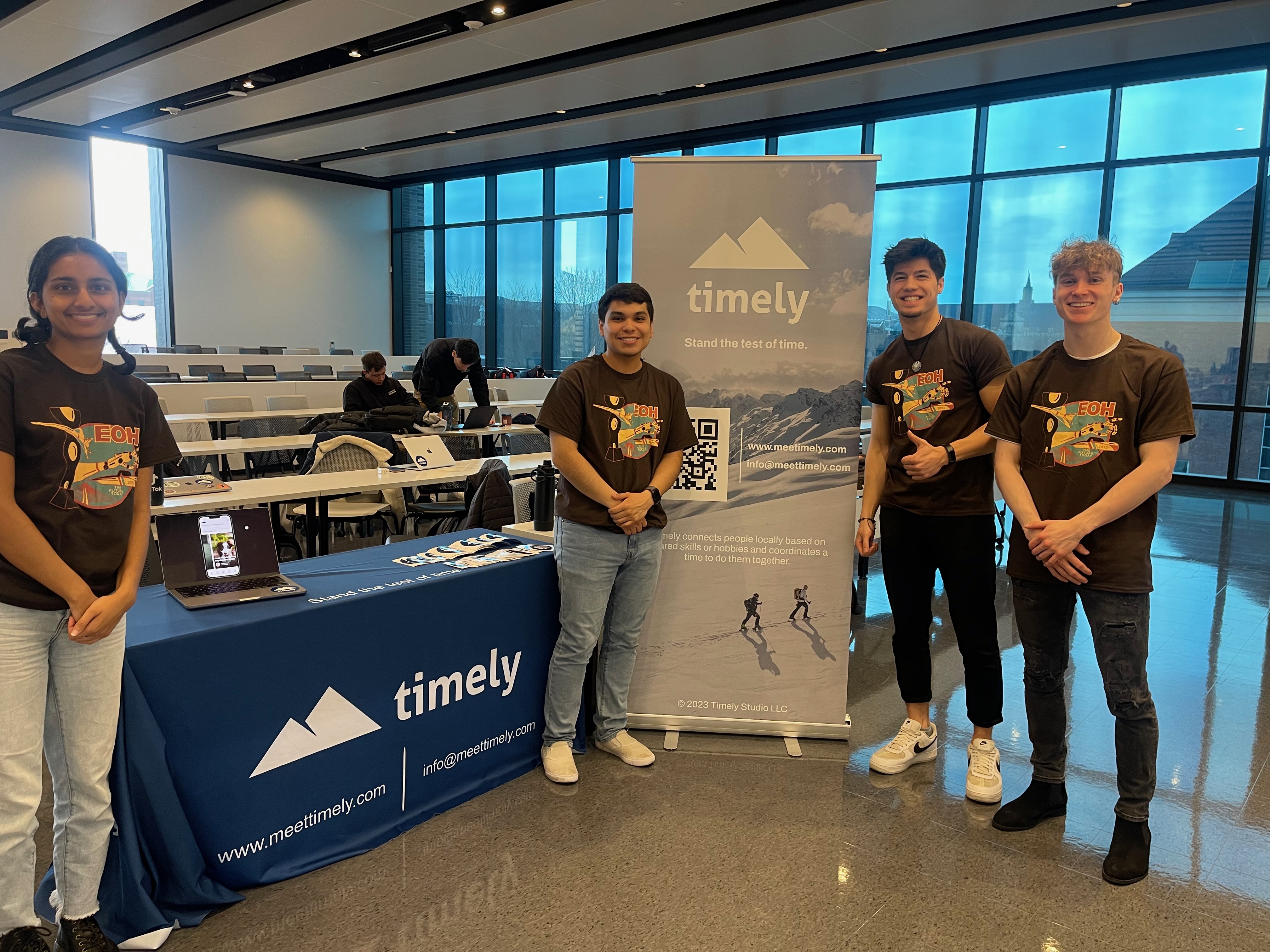 Luke Embers posing with his developer team for his first startup, Timely.