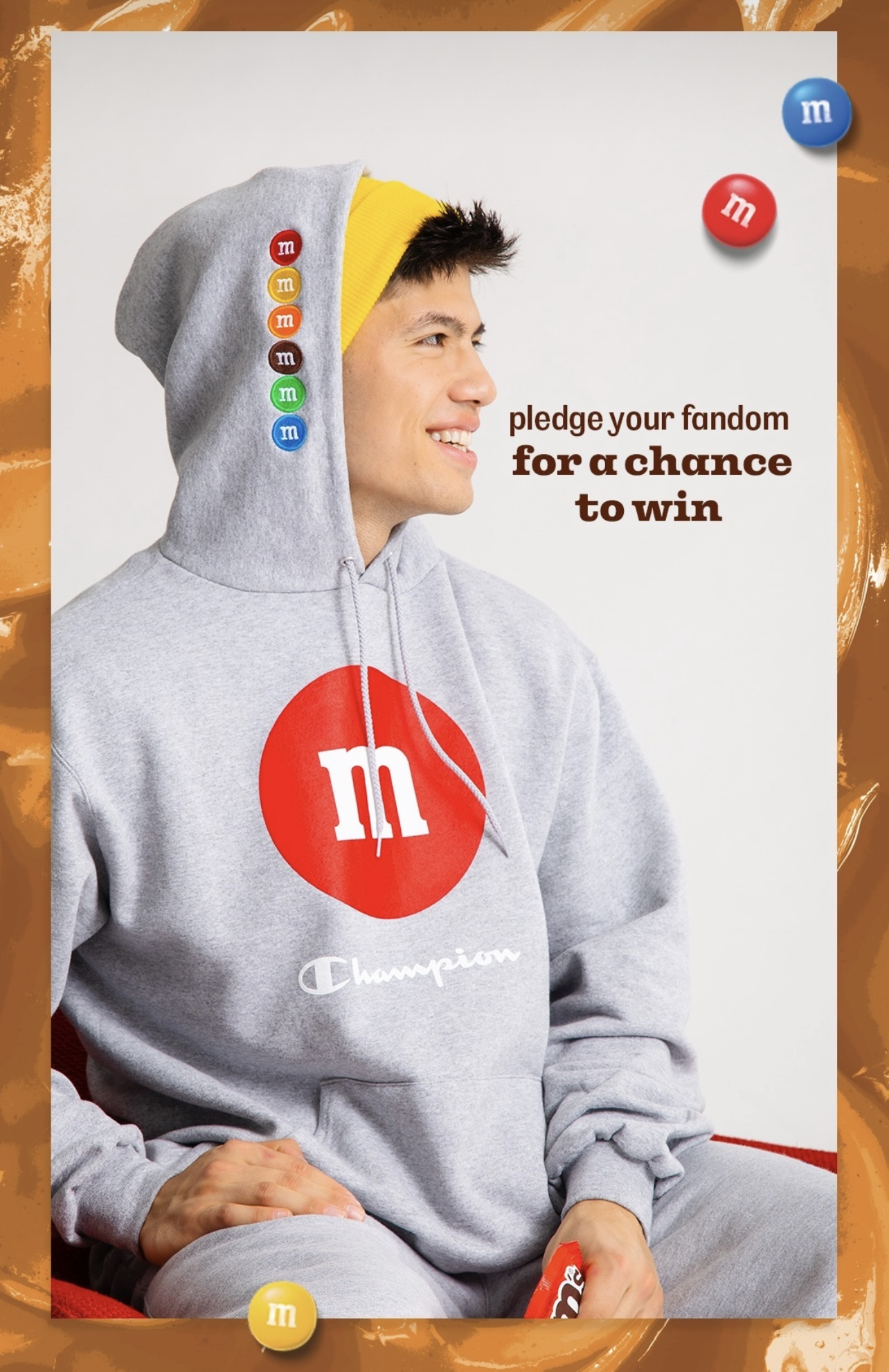 Luke Embers looking to the right for the Champion x M&M collaboration.