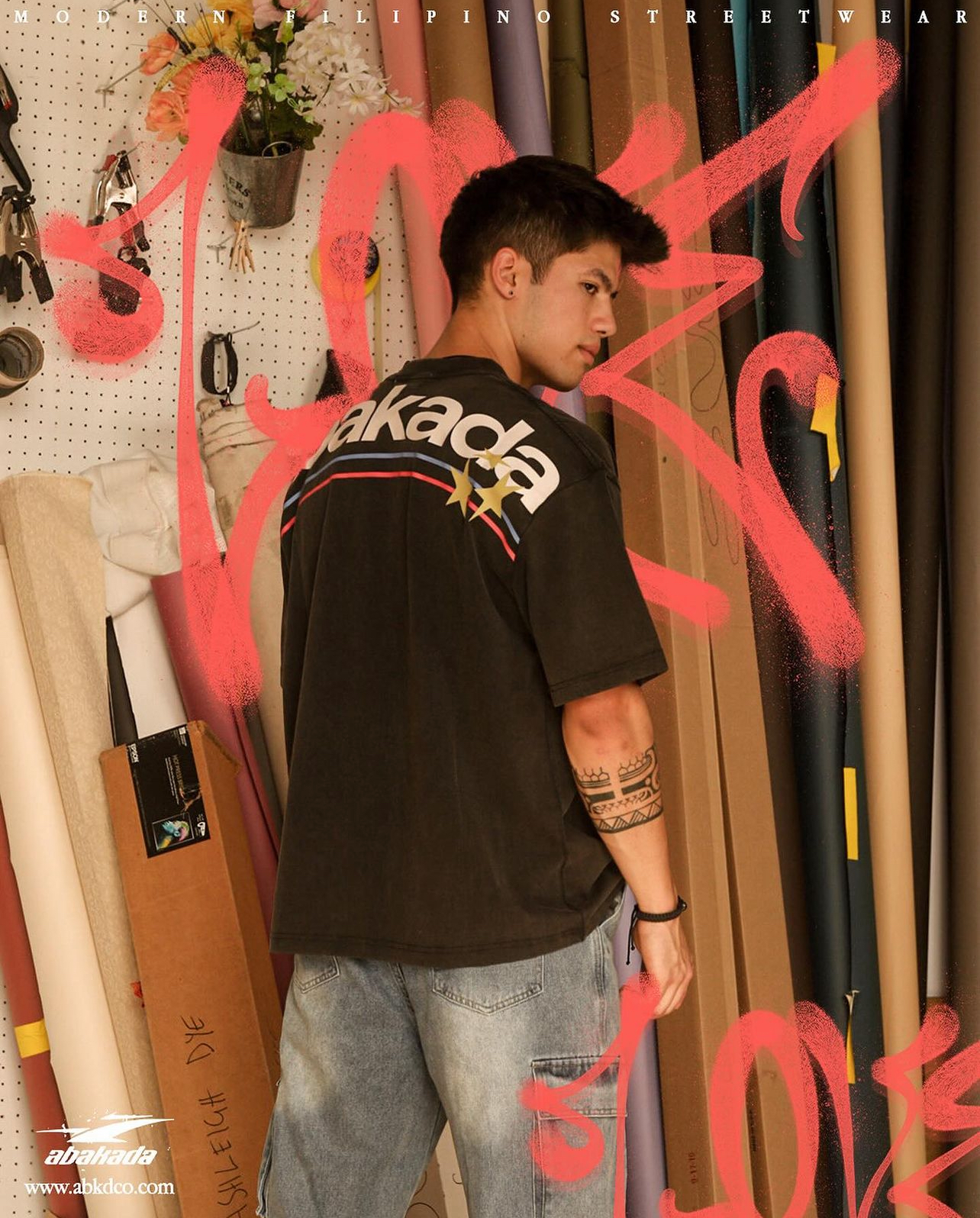 Luke Embers with his back turned to the camera for an Abakada photoshoot.