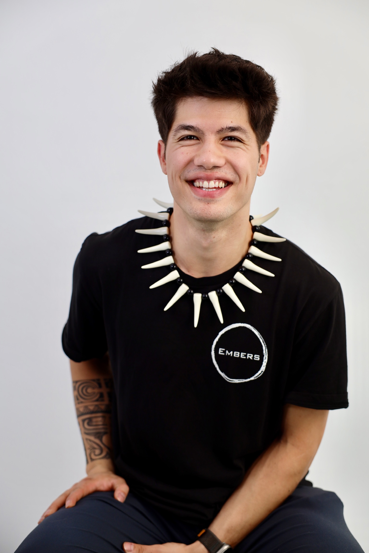 Luke Embers posing on stage with fire