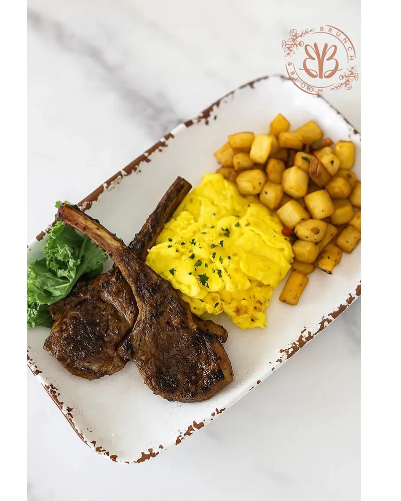 Herb-crusted lamb chops with two eggs any style, breakfast potatoes & chimichurri