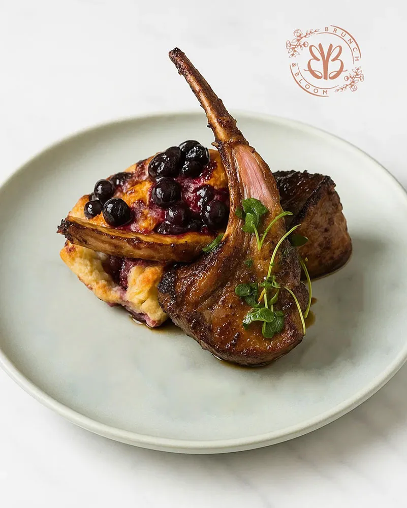 Double cut jerked lamb chop served over a fluffy biscuit