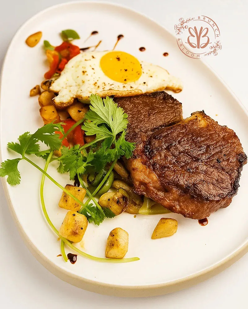 Grilled steak with two eggs any style, roasted potatoes & chimichurri