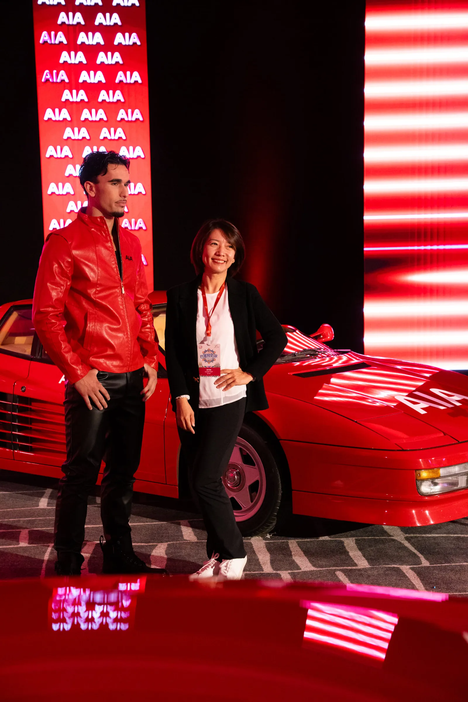 Delegates posing with a hypercar during the corporate summit in Barcelona
