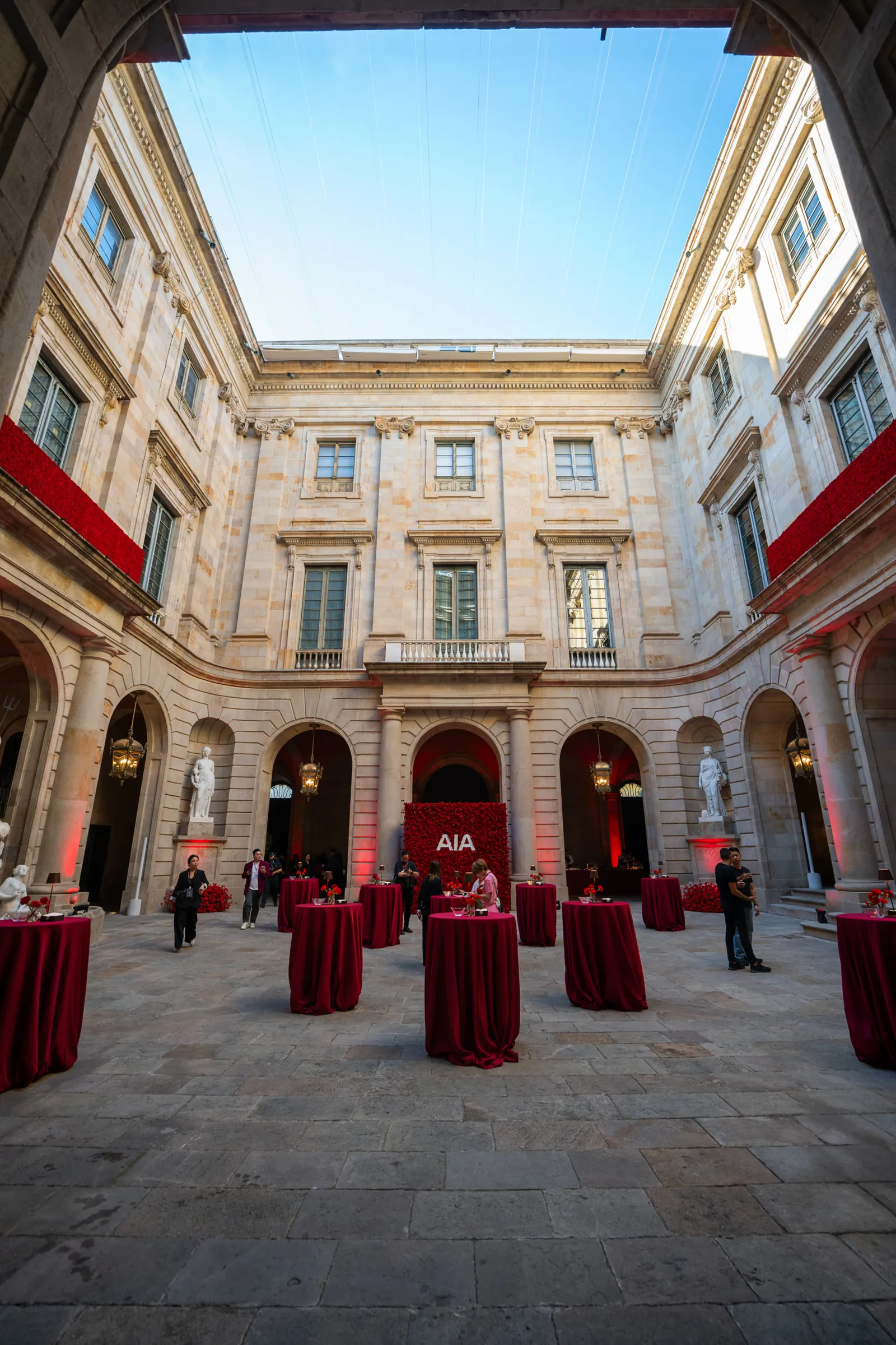 Courtyard of La Llotja de Mar dressed in red for a corporate gala dinner
