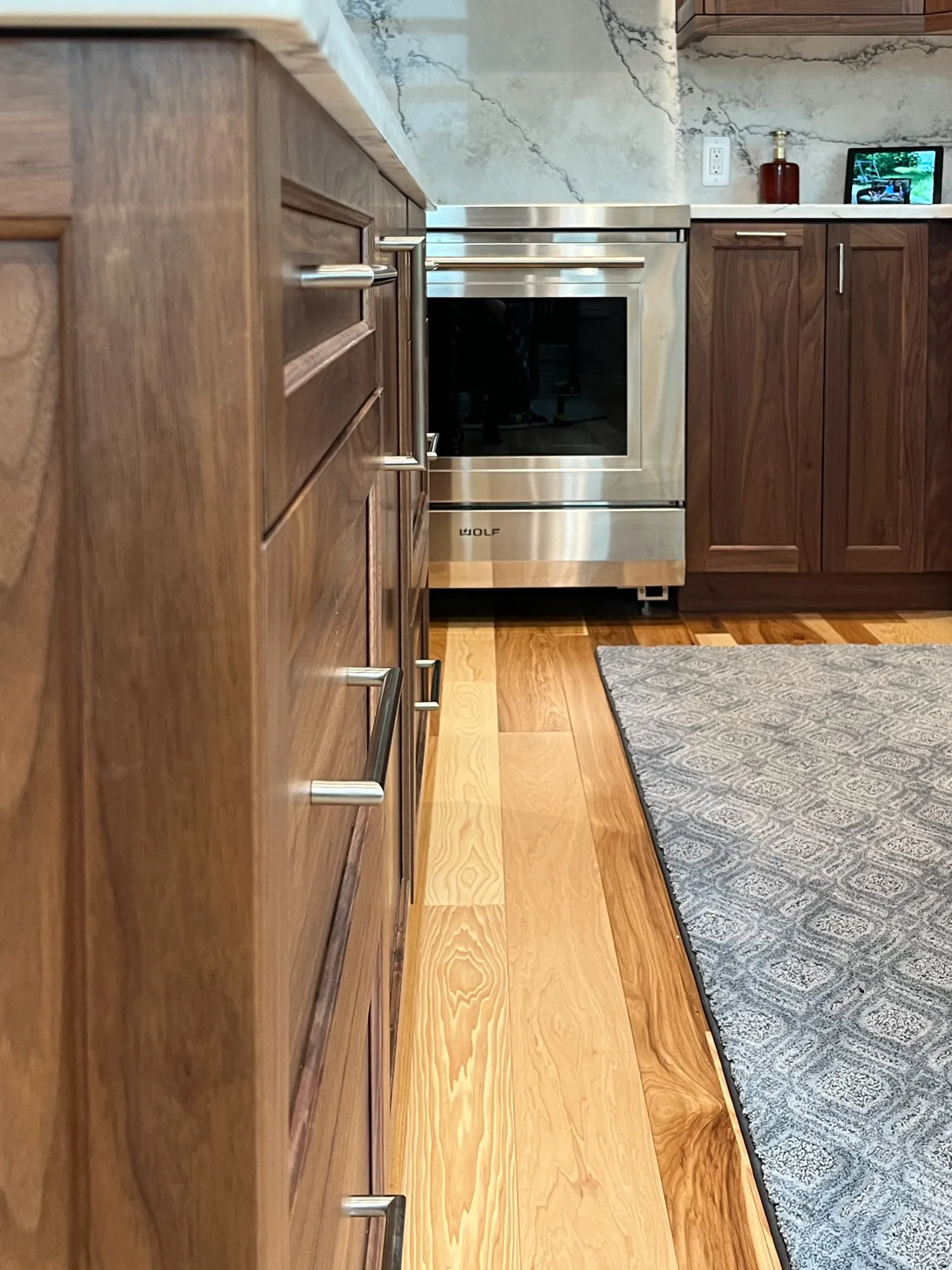 Wood kitchen cabinets with stainless steel oven