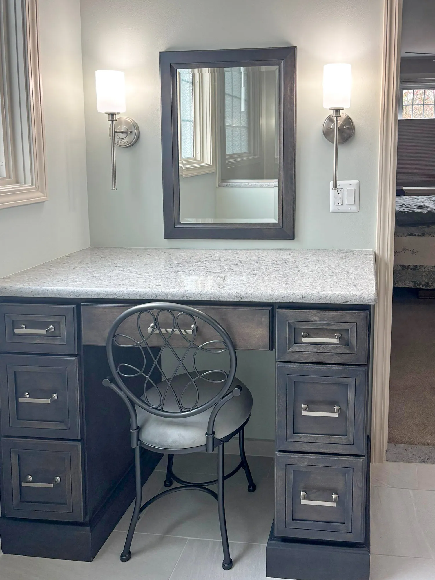 Elegant vanity with dark wood drawers