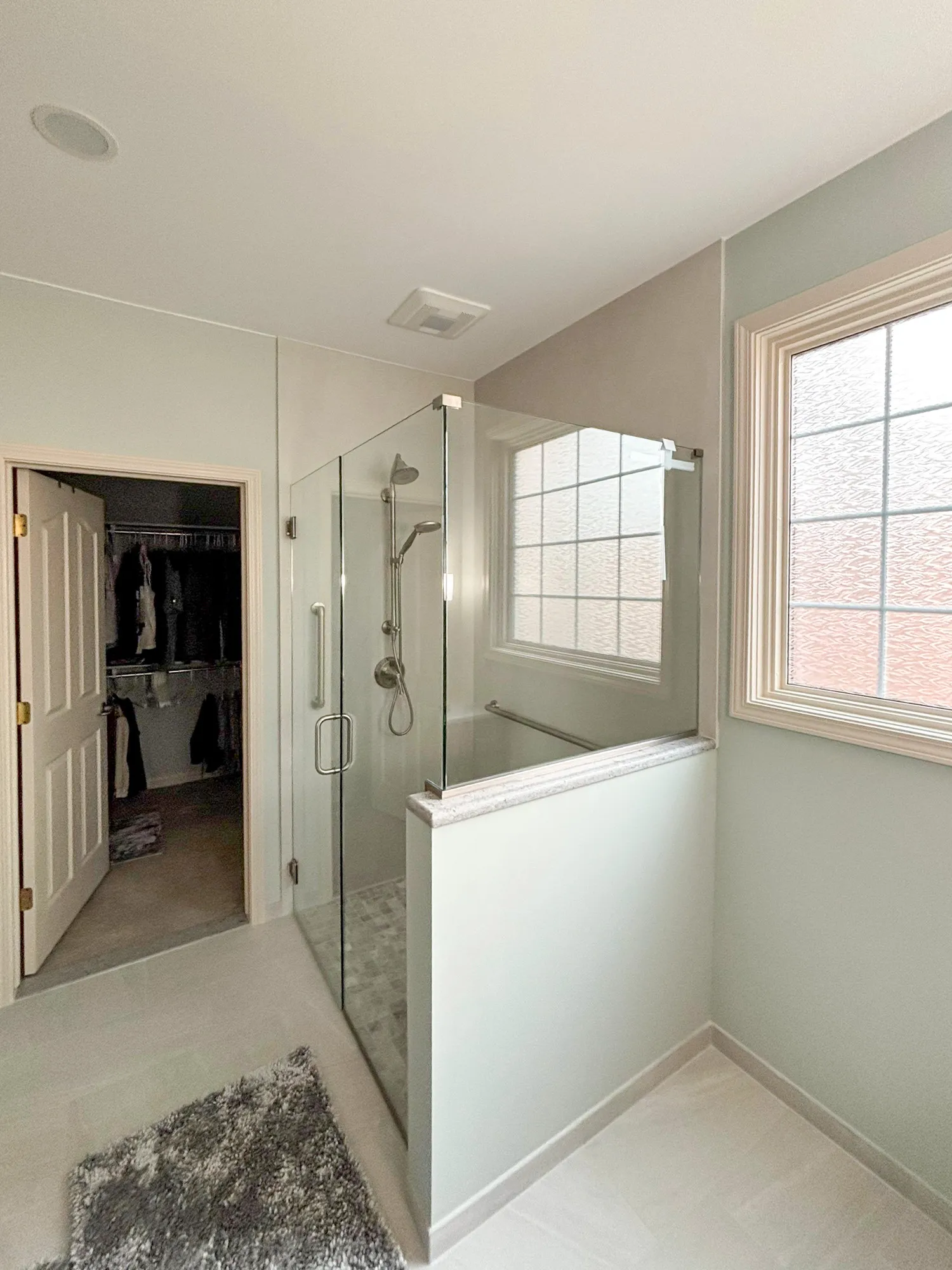 Glass shower enclosure in a modern bathroom