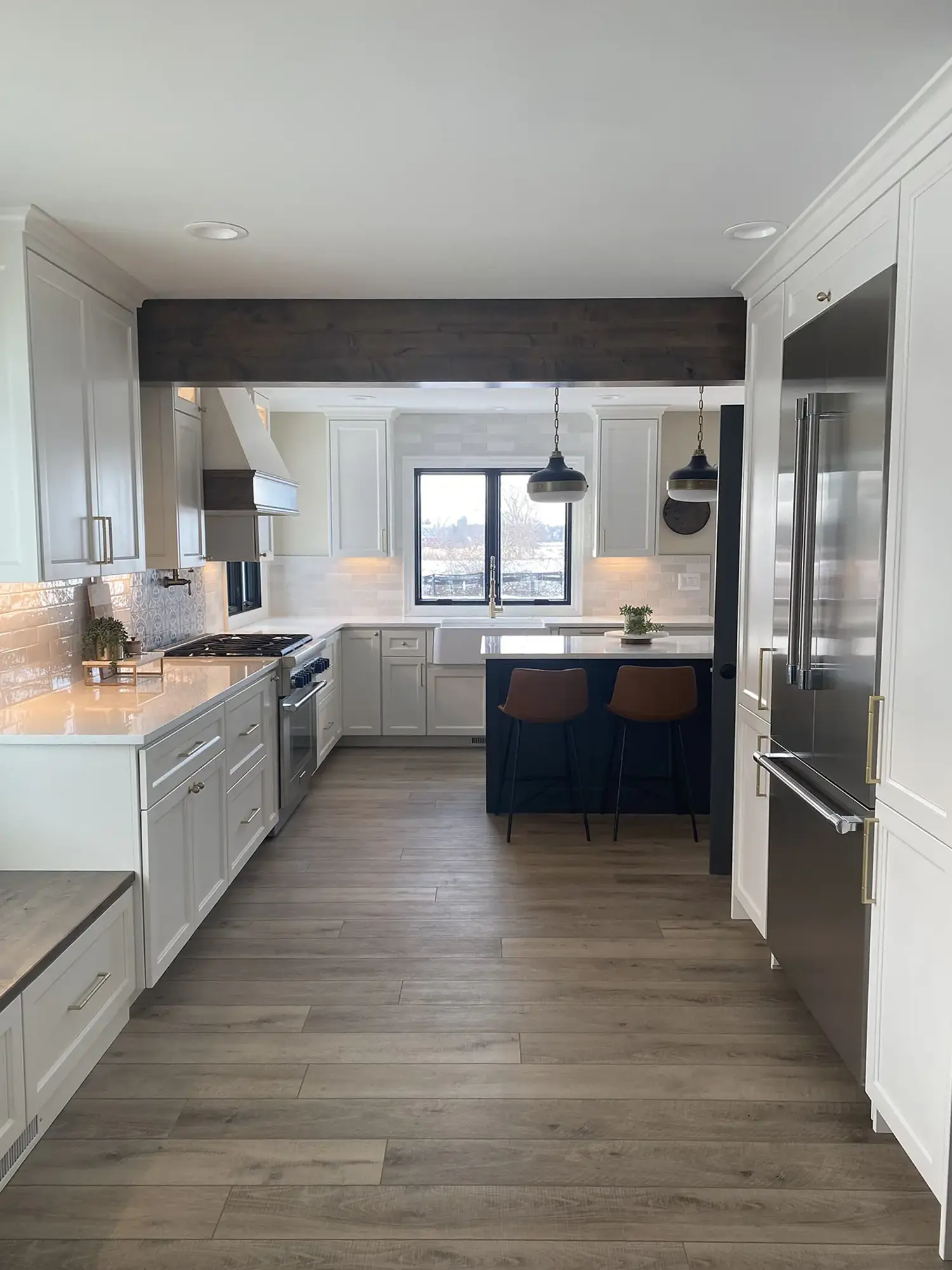 Kitchen with white cabinets, wooden floor