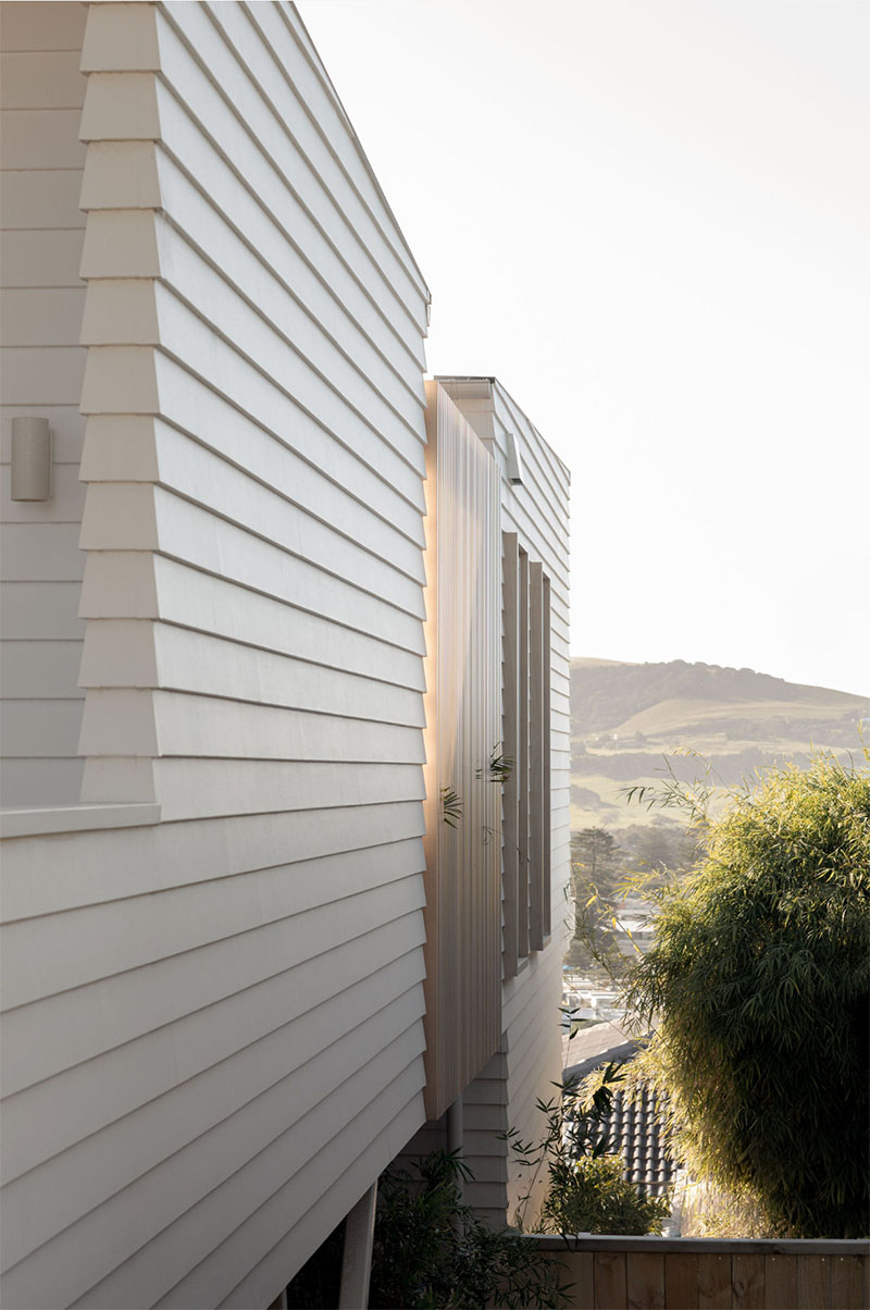 Consistent light-toned finishes across walls and exterior cladding